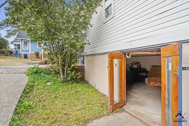 view of side of home featuring a garage