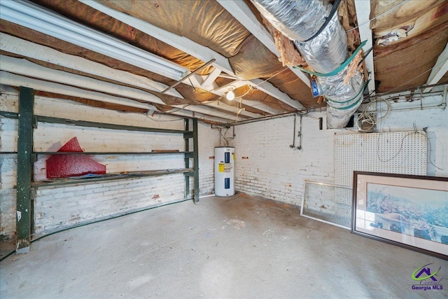 unfinished basement featuring water heater and brick wall