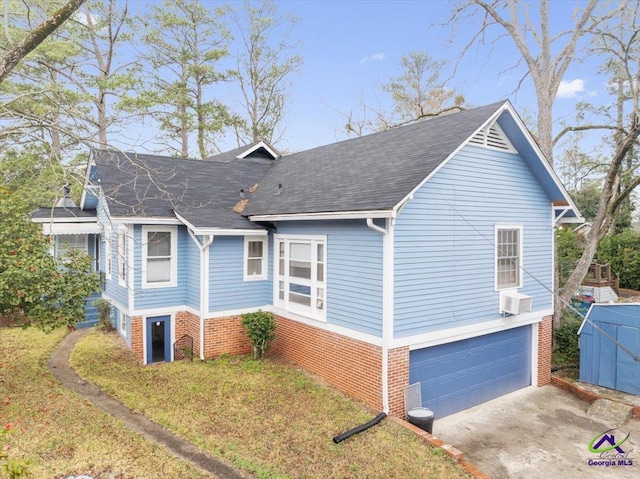 view of side of home featuring concrete driveway, brick siding, an attached garage, and roof with shingles