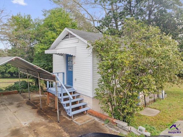 exterior space featuring a carport