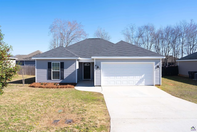 ranch-style home featuring a front lawn, driveway, an attached garage, and fence