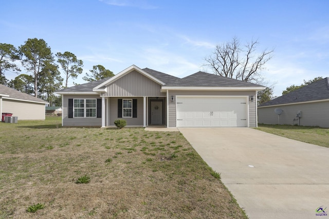 ranch-style house featuring an attached garage, driveway, a front lawn, and board and batten siding