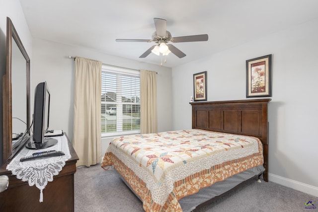 bedroom featuring light carpet, ceiling fan, and baseboards