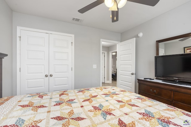 bedroom featuring ceiling fan, visible vents, and a closet