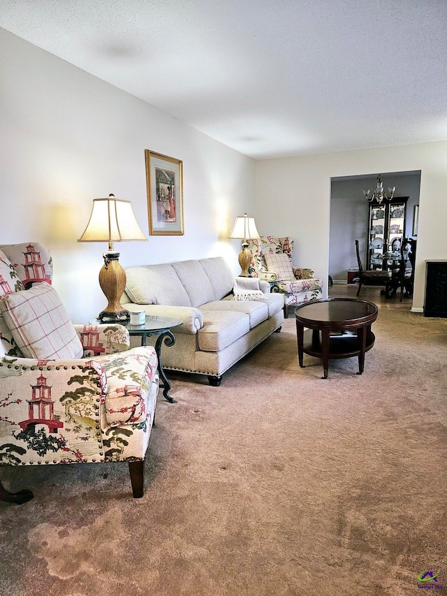 living room with carpet floors and a textured ceiling