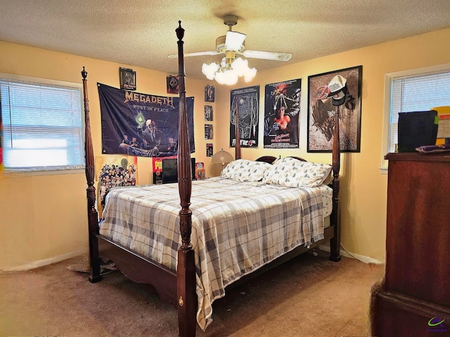 bedroom with a textured ceiling, ceiling fan, carpet flooring, and baseboards