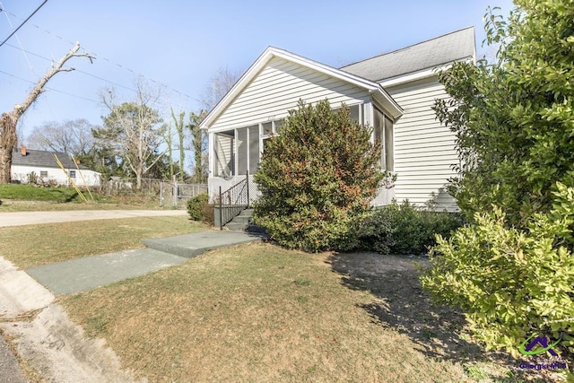 2137 Mutual Ave, Macon, GA 31204 - view of side of property featuring entry steps, a lawn, and fence