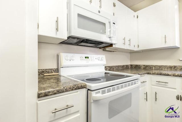 kitchen with white appliances and white cabinets