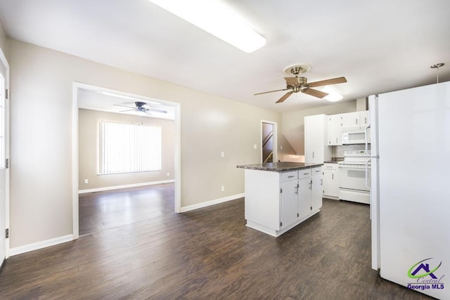 kitchen with white appliances, baseboards, dark wood finished floors, ceiling fan, and white cabinetry