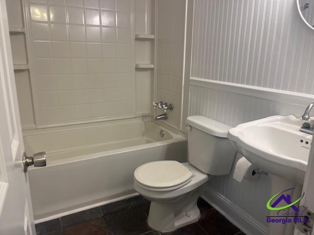 324 Jefferson Park Dr, Macon, GA 31220 - bathroom with shower / bath combination, tile patterned flooring, and toilet