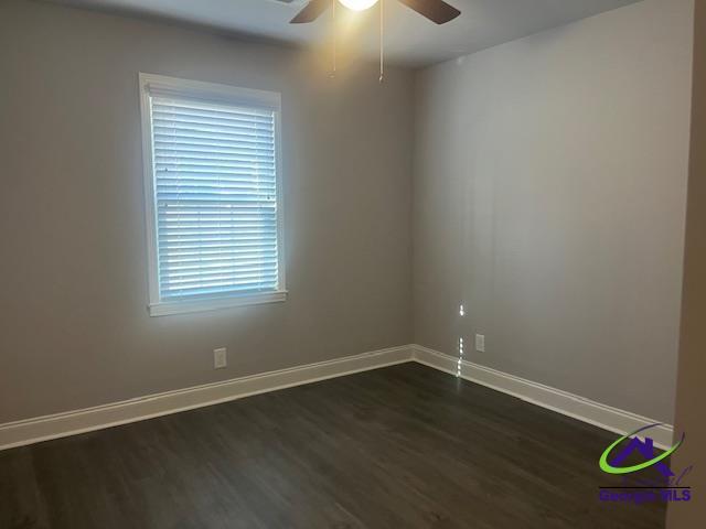 324 Jefferson Park Dr, Macon, GA 31220 - empty room featuring dark wood-style flooring, a ceiling fan, and baseboards