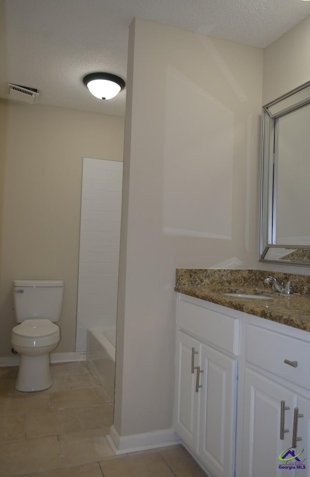 bathroom with visible vents, toilet, tile patterned flooring, a textured ceiling, and vanity