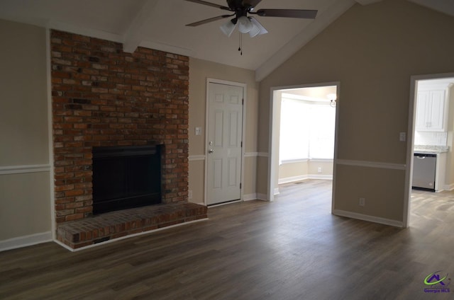 unfurnished living room with vaulted ceiling with beams, a brick fireplace, dark wood finished floors, and a ceiling fan