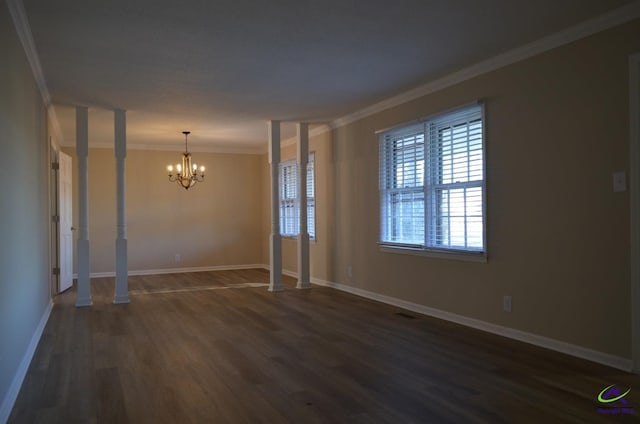 interior space with baseboards, dark wood-type flooring, an inviting chandelier, and crown molding