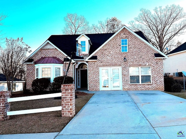 view of front of home featuring french doors and brick siding