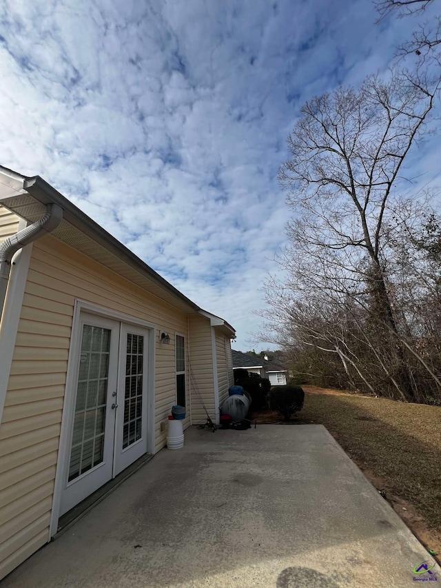 view of home's exterior with french doors and a patio area