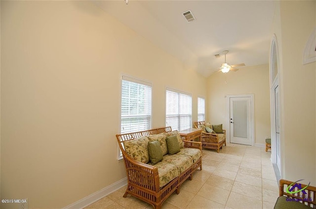 sitting room with lofted ceiling, visible vents, ceiling fan, and baseboards