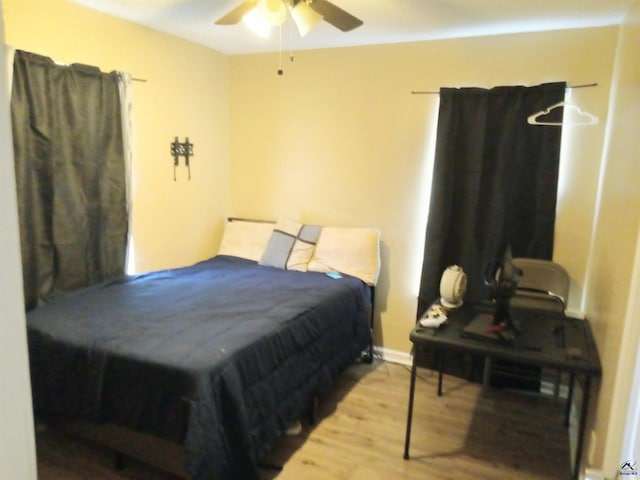 bedroom featuring ceiling fan and wood finished floors