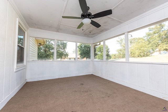 unfurnished sunroom featuring ceiling fan