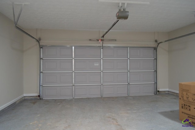 garage with baseboards and a garage door opener