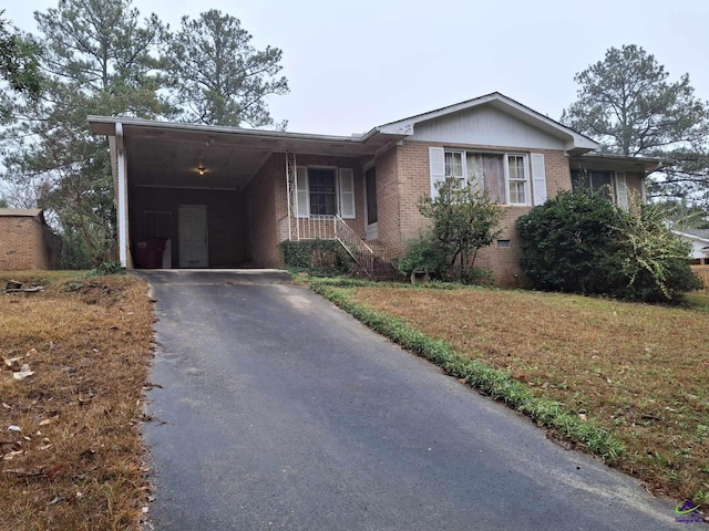 3271 Commodore Dr, Macon, GA 31211 - ranch-style home featuring aphalt driveway, a carport, and brick siding