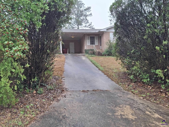 3271 Commodore Dr, Macon, GA 31211 - view of front of house with an attached carport, brick siding, and aphalt driveway