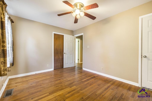 3271 Commodore Dr, Macon, GA 31211 - unfurnished bedroom featuring baseboards, visible vents, and wood finished floors