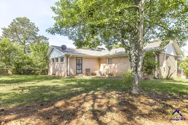 3271 Commodore Dr, Macon, GA 31211 - exterior space featuring a yard and brick siding