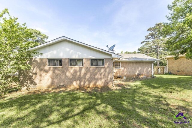 3271 Commodore Dr, Macon, GA 31211 - back of property with a yard and brick siding