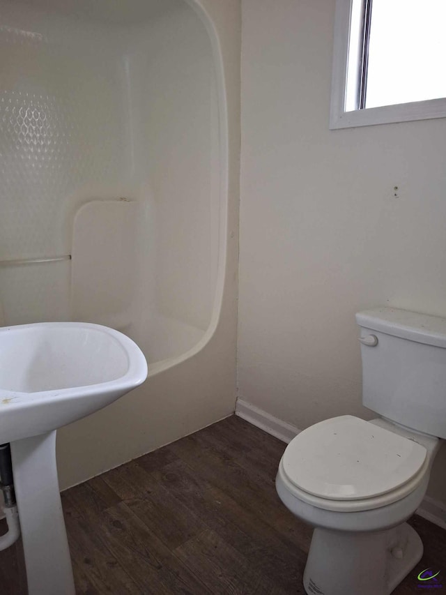 3271 Commodore Dr, Macon, GA 31211 - full bathroom featuring walk in shower, toilet, wood finished floors, a bathing tub, and baseboards