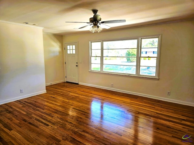 entryway featuring a ceiling fan, crown molding, baseboards, and wood finished floors