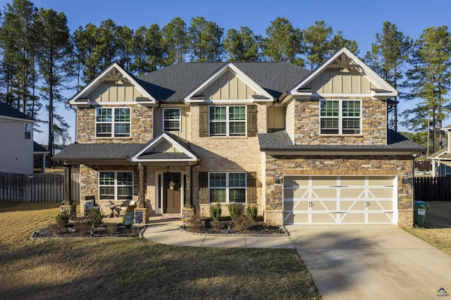 craftsman-style home featuring driveway, a shingled roof, an attached garage, fence, and board and batten siding