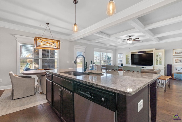 kitchen with a wealth of natural light, dark wood-style floors, beamed ceiling, stainless steel dishwasher, and a sink