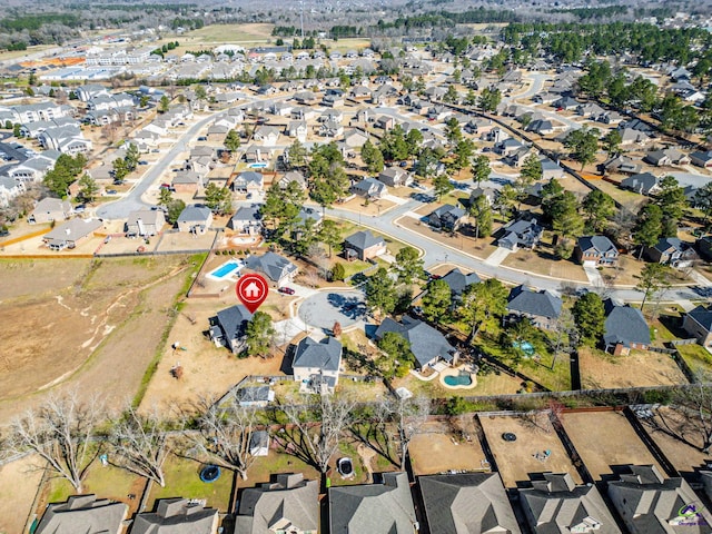 birds eye view of property with a residential view