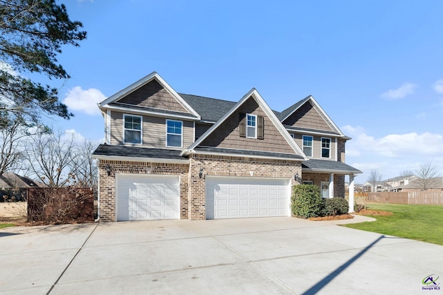 view of front of house featuring concrete driveway, brick siding, fence, and an attached garage