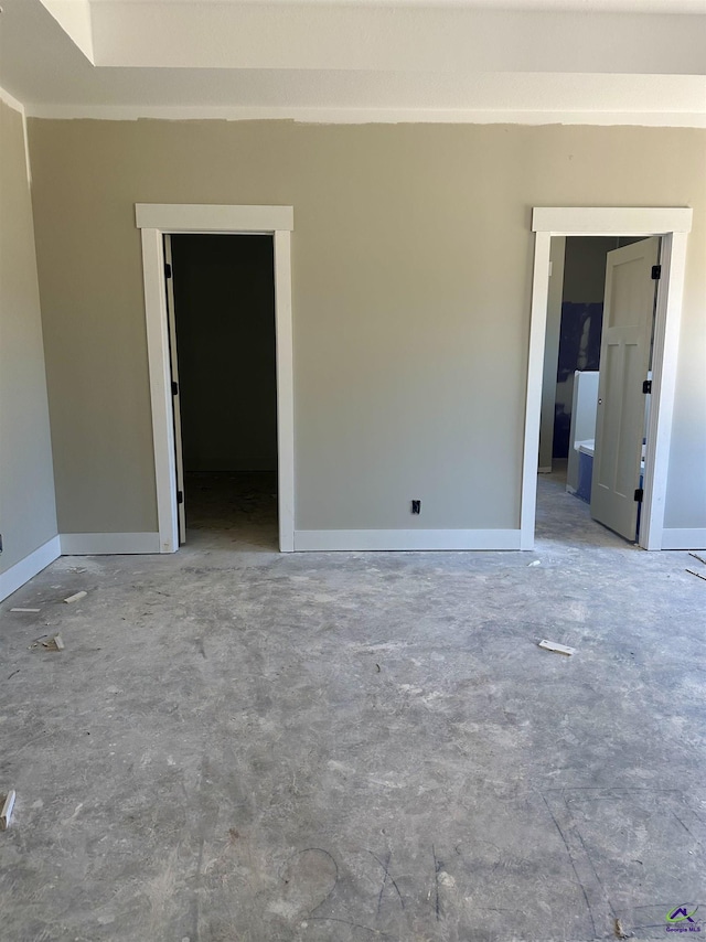 empty room featuring baseboards