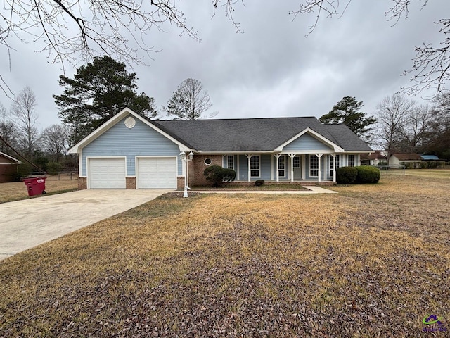 ranch-style home with covered porch, driveway, a front lawn, and a garage