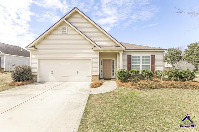 view of front facade featuring a garage, concrete driveway, and a front yard