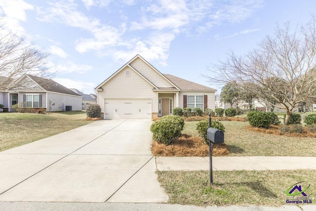 view of front of home with driveway, a garage, and a front lawn