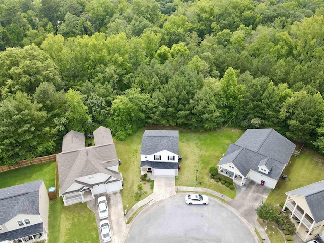 aerial view featuring a forest view and a residential view