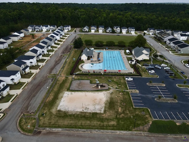 aerial view featuring a residential view and a view of trees