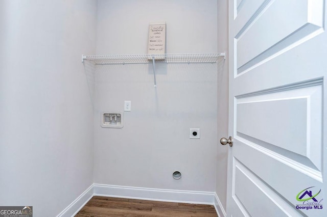 422 Chelsea Leigh Ave, Bonaire, GA 31005 - laundry room with laundry area, electric dryer hookup, washer hookup, dark wood-style flooring, and baseboards