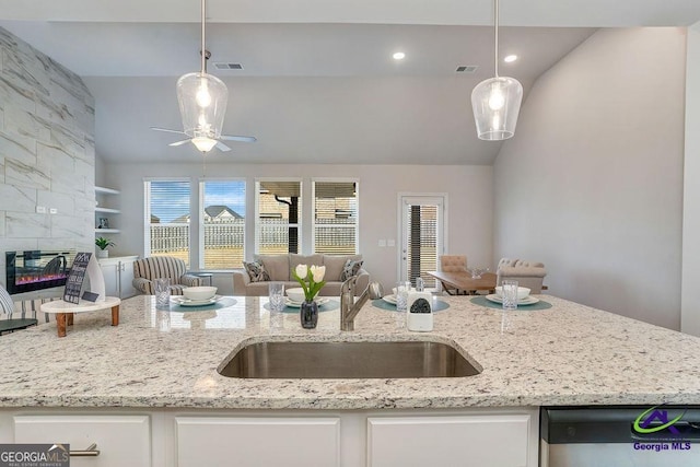 422 Chelsea Leigh Ave, Bonaire, GA 31005 - kitchen featuring visible vents, dishwasher, a sink, lofted ceiling, and open floor plan