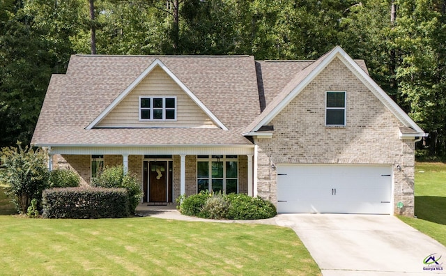 craftsman house with brick siding and a front yard