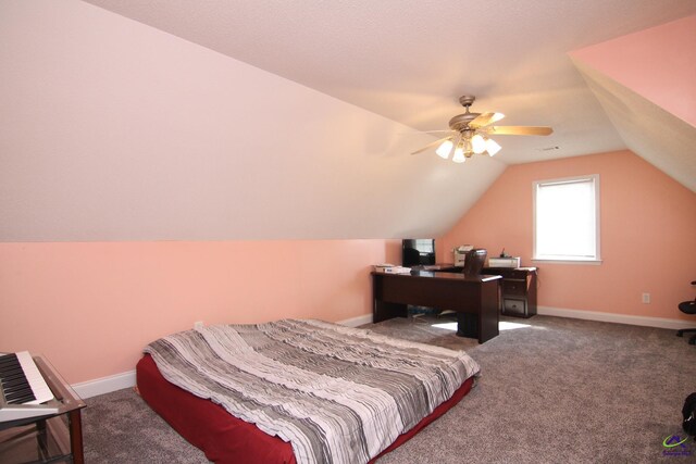 bedroom featuring carpet floors, vaulted ceiling, baseboards, and ceiling fan