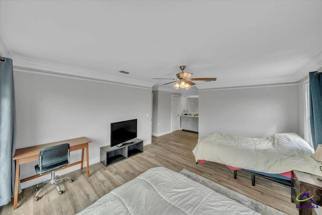 bedroom with baseboards, visible vents, a ceiling fan, ornamental molding, and wood finished floors