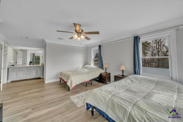 bedroom featuring light wood-style floors, multiple windows, crown molding, and baseboards