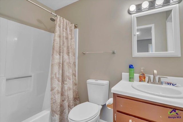 bathroom featuring shower / bath combo, vanity, and toilet