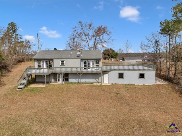 back of property featuring a yard, stairs, french doors, and a wooden deck