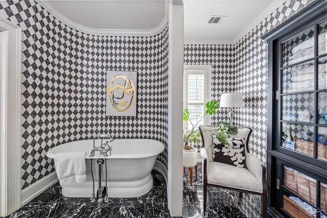 bathroom with marble finish floor, visible vents, a freestanding bath, ornamental molding, and wallpapered walls